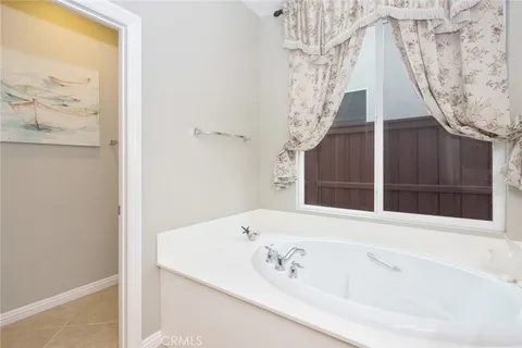 a view of bathroom with bathtub and shower