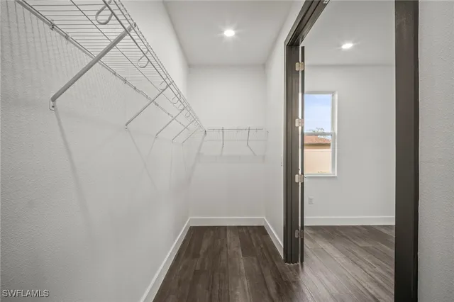 a view of hallway with wooden floor