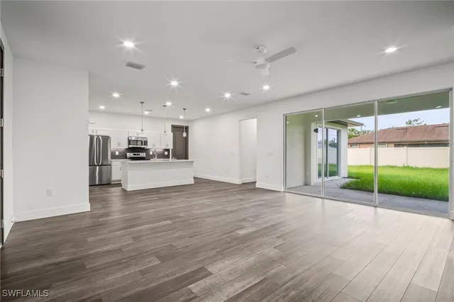 a view of kitchen with a sink and a stove top oven