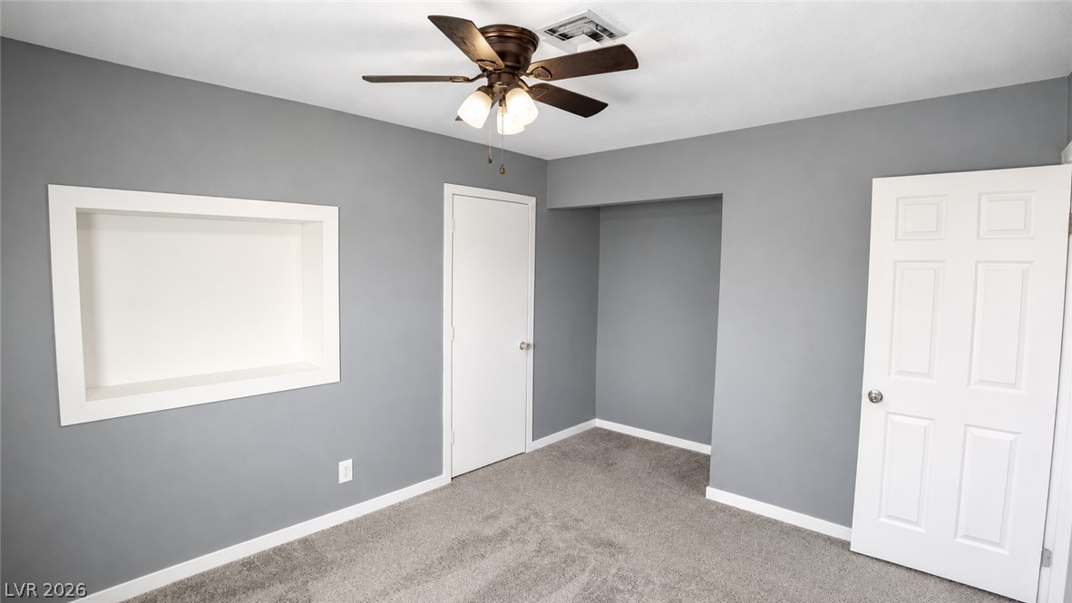 2870 South Sandhill Road Las Vegas, NV 89121 - Photo 40 of 64 An inviting sleeping space with cozy carpeted floors and a recessed display niche.
