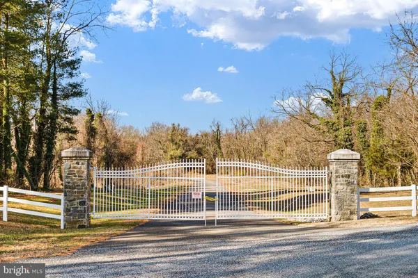 a view of a swimming pool with an outdoor seating and a pathway