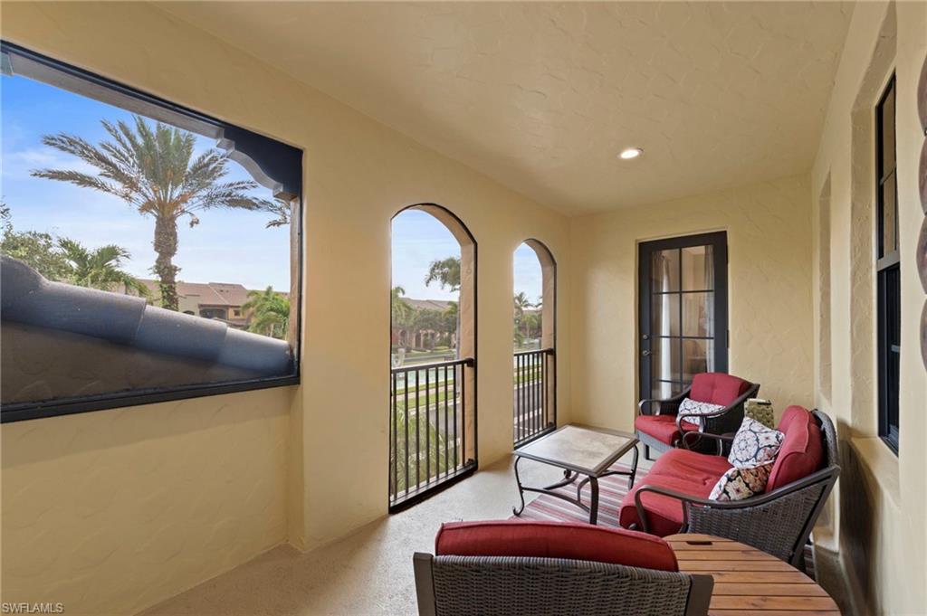 9076 Rialto Street, Unit 6204 Naples, FL 34113 - Photo 26 of 50 Large screened lanai overlooking the water feature boulevard. NEW NO-SEE-UM SCREEN (2025)