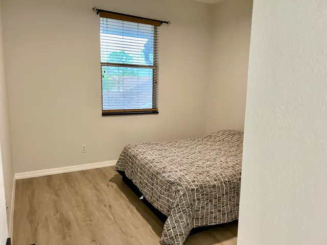 a bedroom with a bed and a cabinets