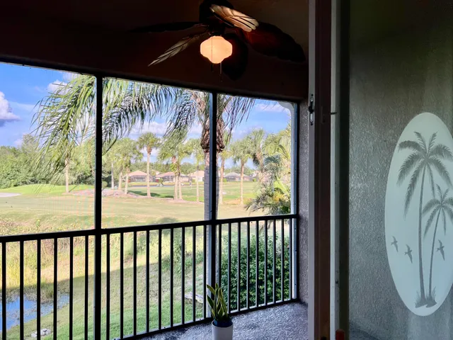 a view of a porch with a floor to ceiling window
