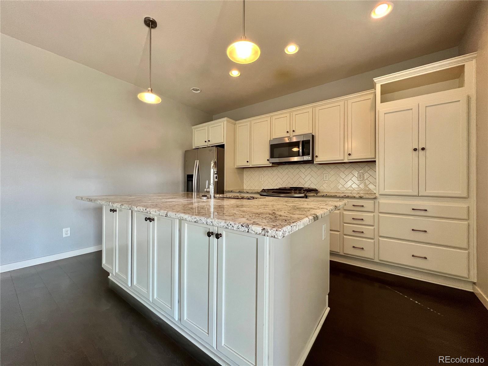 14000 Touchstone Point Parker, CO 80134 - Photo 3 of 19 a kitchen with cabinets appliances and a window
