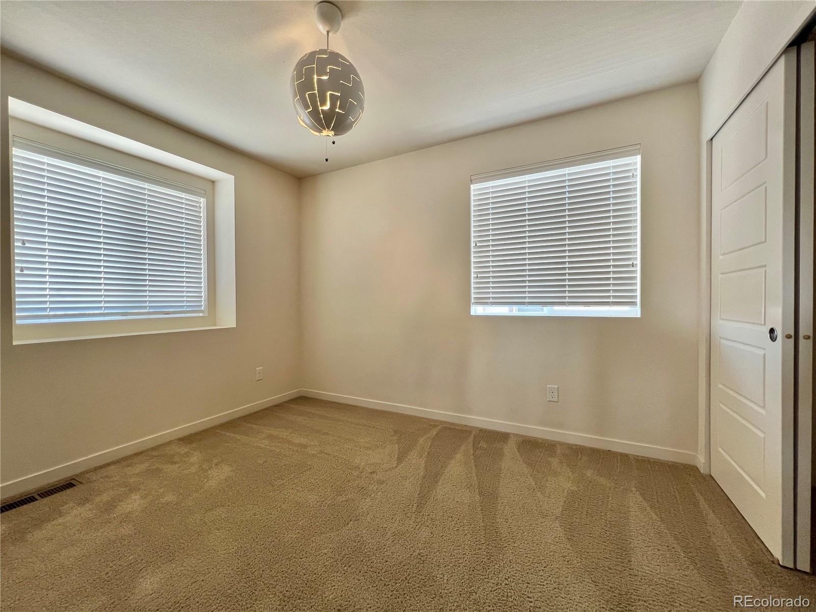 14000 Touchstone Point Parker, CO 80134 - Photo 7 of 19 an empty room with a window
