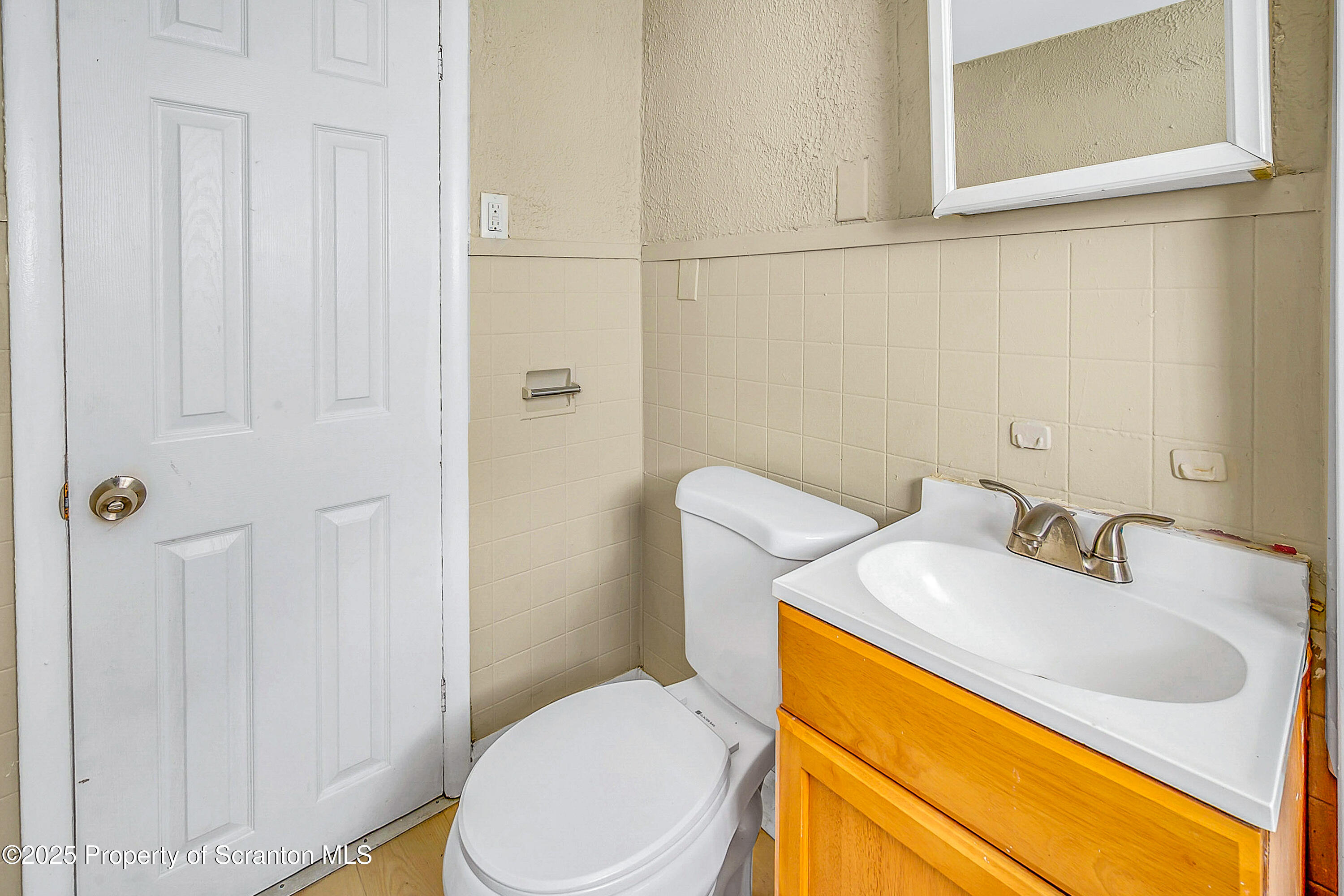 1007 Washburn Street, Unit 2 Scranton, PA 18504 - Photo 15 of 16 a bathroom with a sink and a toilet