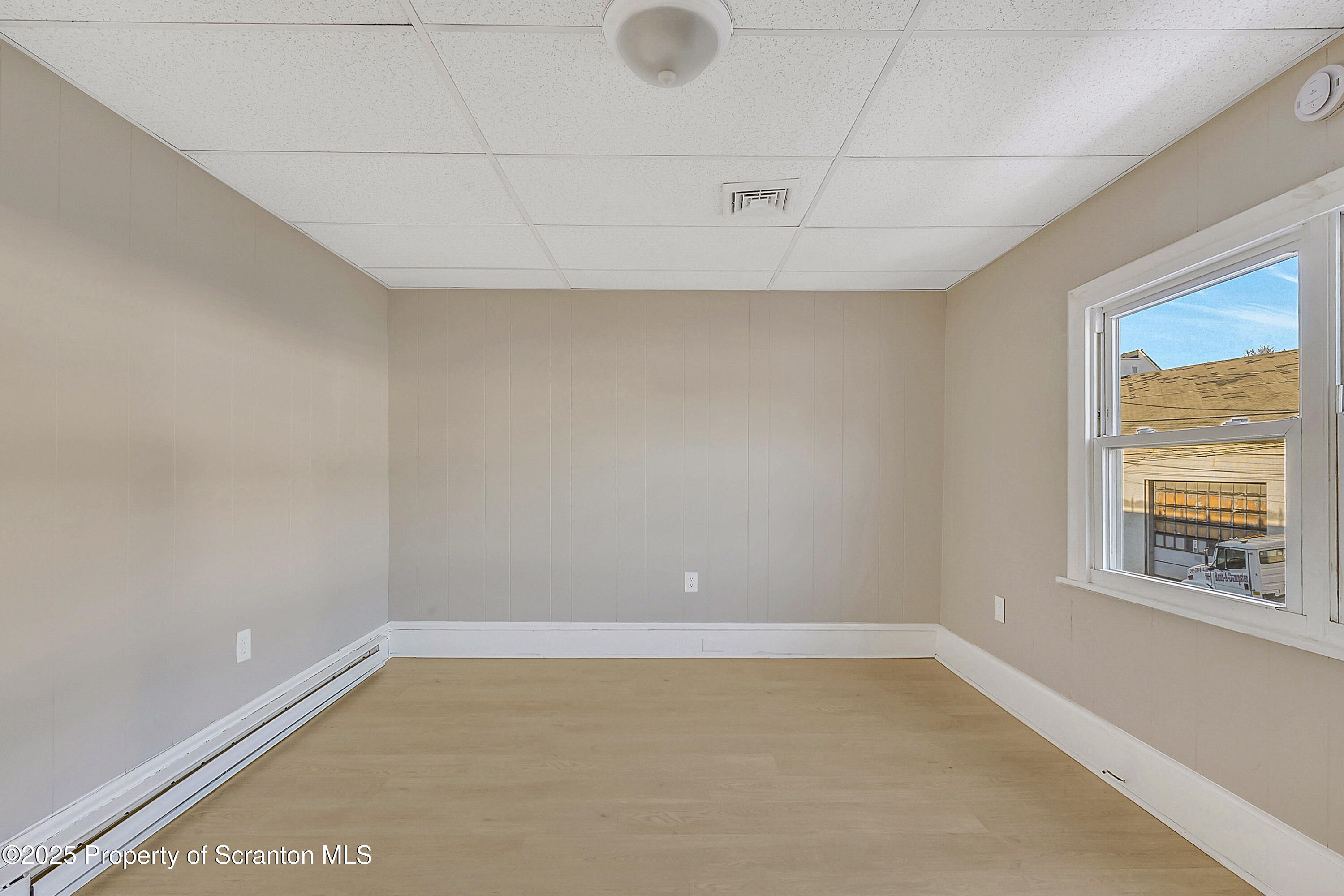 1007 Washburn Street, Unit 2 Scranton, PA 18504 - Photo 5 of 16 a view of an empty room with a window