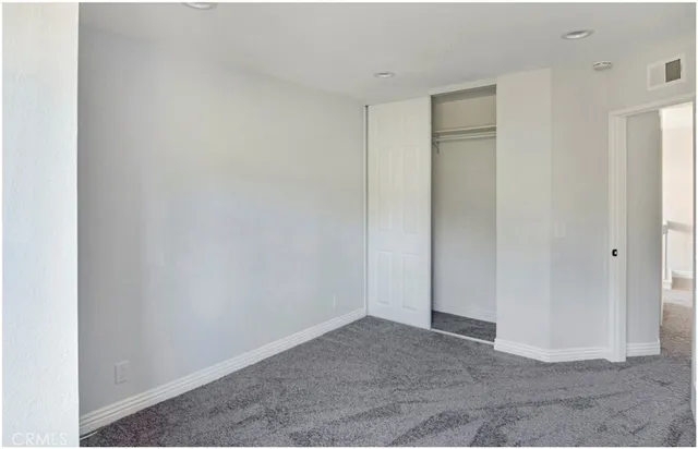 a bathroom with a shower a toilet and a shower