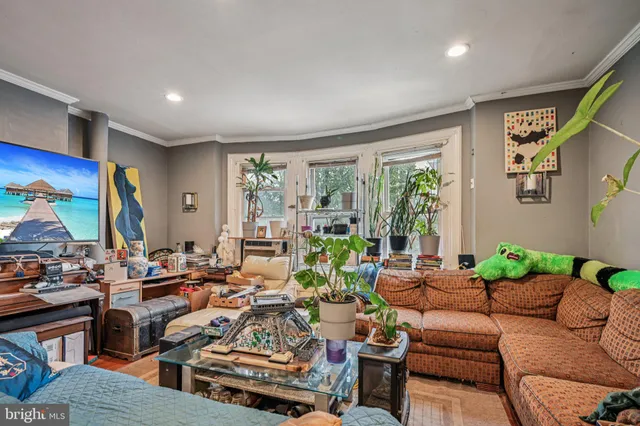 a very nice looking living room with a large window