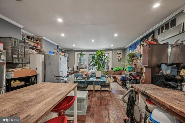 a kitchen with stainless steel appliances a stove a refrigerator and a refrigerator