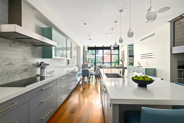 a living room with furniture a window and appliances