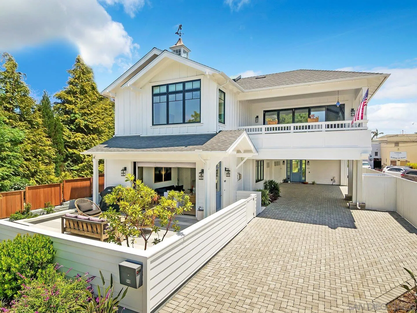 949 D Avenue Coronado, CA 92118 - Photo 1 of 28 a front view of a house with garden