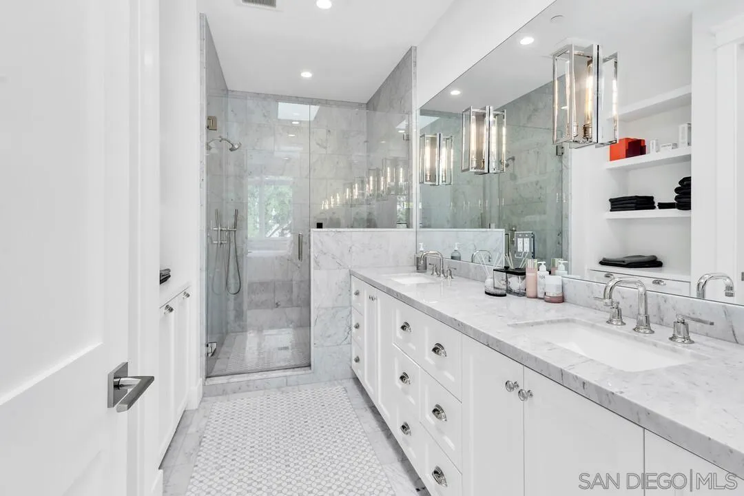 949 D Avenue Coronado, CA 92118 - Photo 13 of 28 a bathroom with double sink and shower