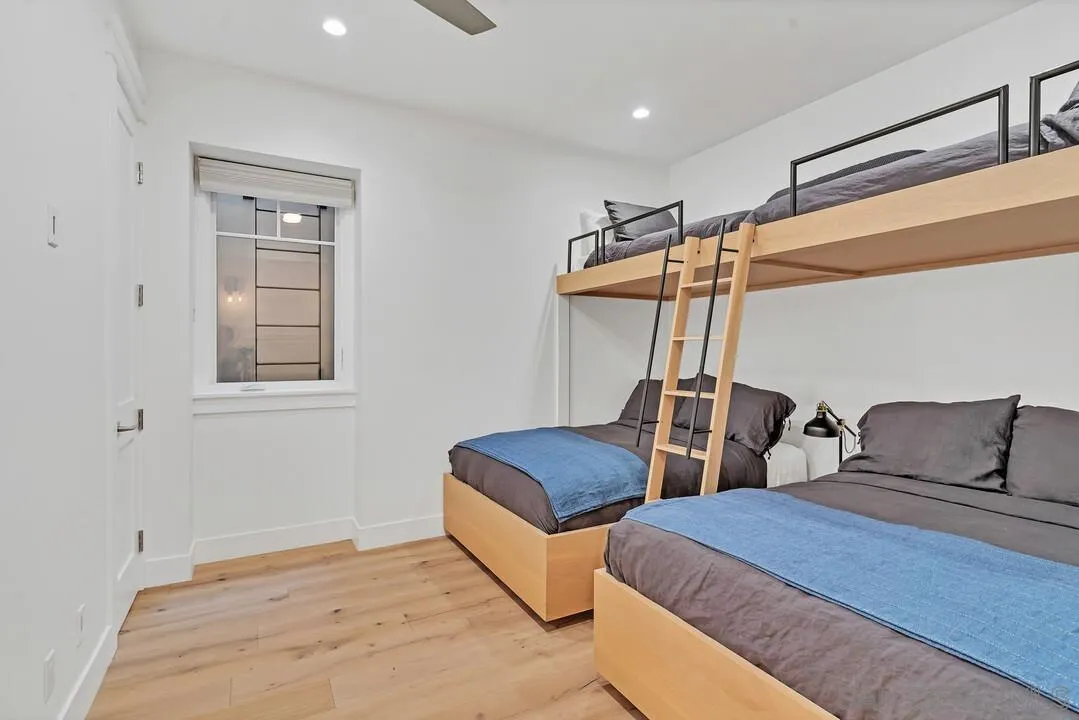 949 D Avenue Coronado, CA 92118 - Photo 22 of 28 a bedroom with two beds and painted walls