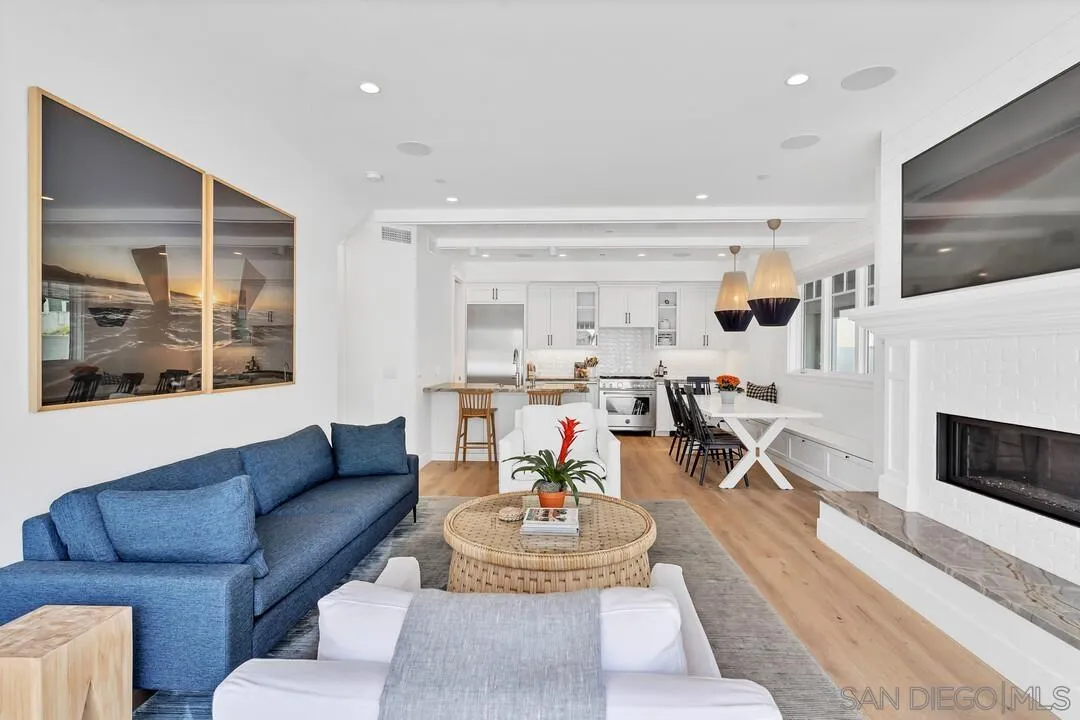 949 D Avenue Coronado, CA 92118 - Photo 3 of 28 a living room with furniture and a fireplace