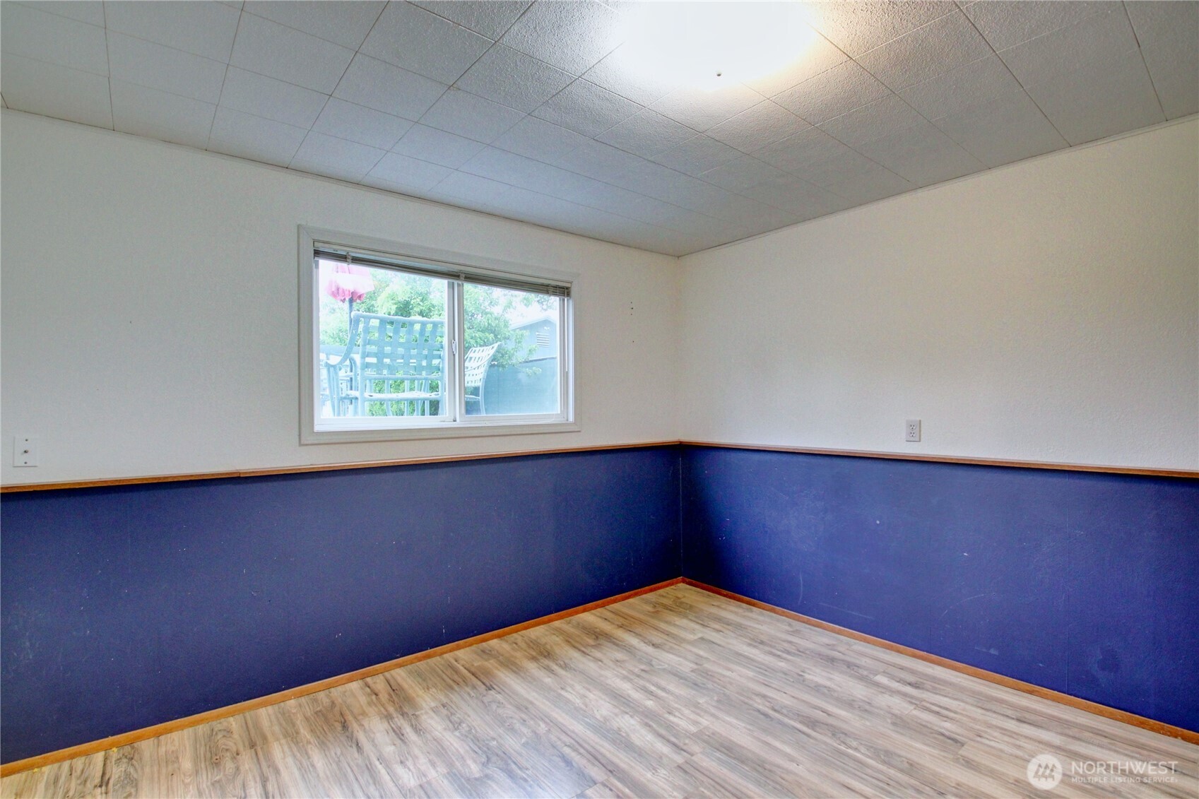 13168 Avon Allen Road Mount Vernon, WA 98273 - Photo 19 of 34 an empty room with wooden floor and windows