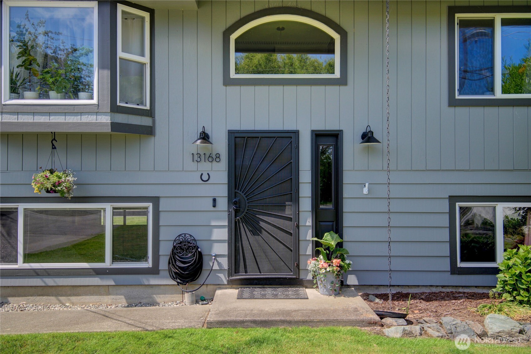 13168 Avon Allen Road Mount Vernon, WA 98273 - Photo 2 of 34 a front view of a house with garden