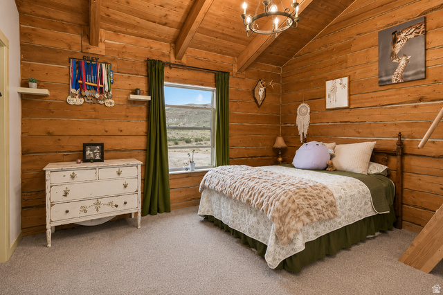 544 East 600 North, Unit 1 Joseph, UT 84739 - Photo 26 of 65 Room featuring light wood-finish log walls, a vaulted ceiling with exposed beams, and a window providing natural light