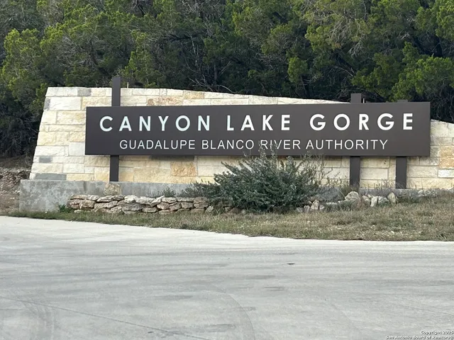 a sign broad on the side of the park