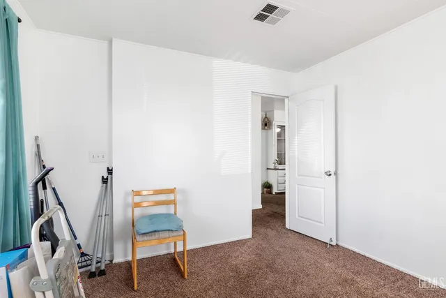 a living room with furniture potted plant and a window