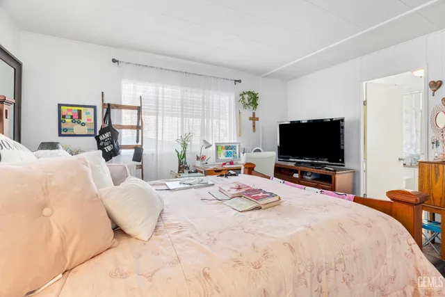 a bedroom with a bed and furniture