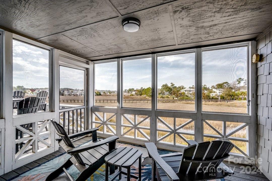 4396 Baldwin Avenue, Unit 40 Little River, SC 29566 - Photo 12 of 24 a view of a city from a balcony with furniture