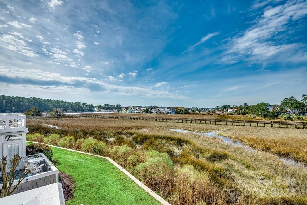4396 Baldwin Avenue, Unit 40 Little River, SC 29566 - Photo 21 of 24 a view of a lake with houses in the back
