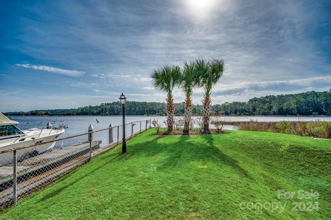 4396 Baldwin Avenue, Unit 40 Little River, SC 29566 - Photo 24 of 24 a view of a terrace with a garden