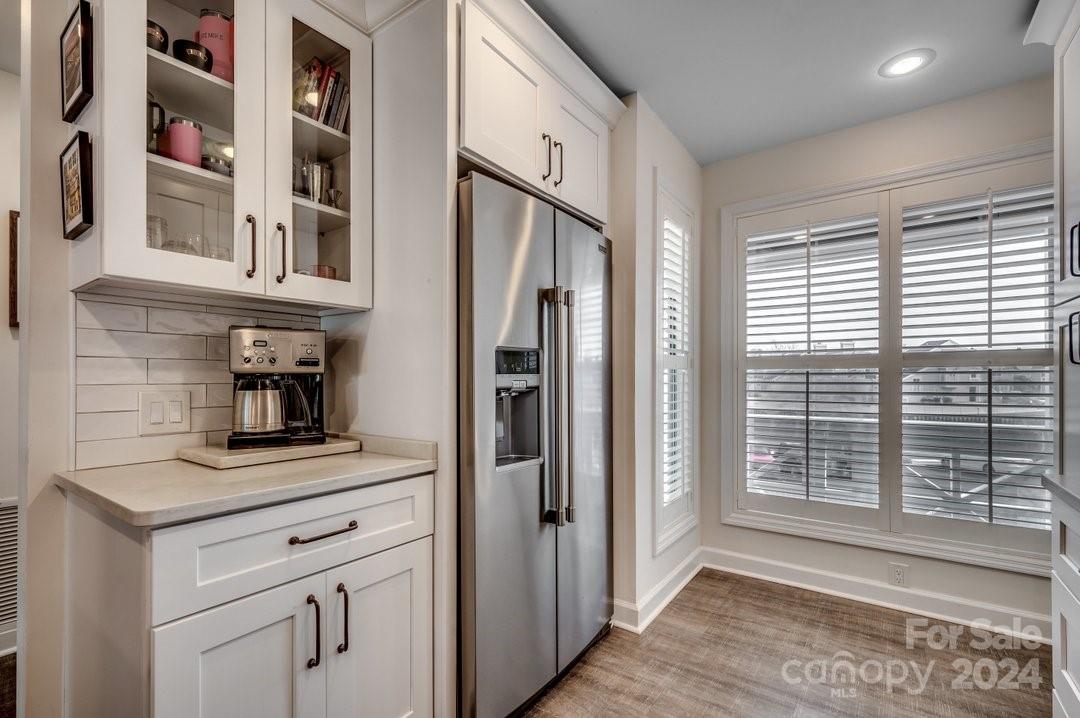 4396 Baldwin Avenue, Unit 40 Little River, SC 29566 - Photo 5 of 24 a kitchen with stainless steel appliances granite countertop a refrigerator and a sink