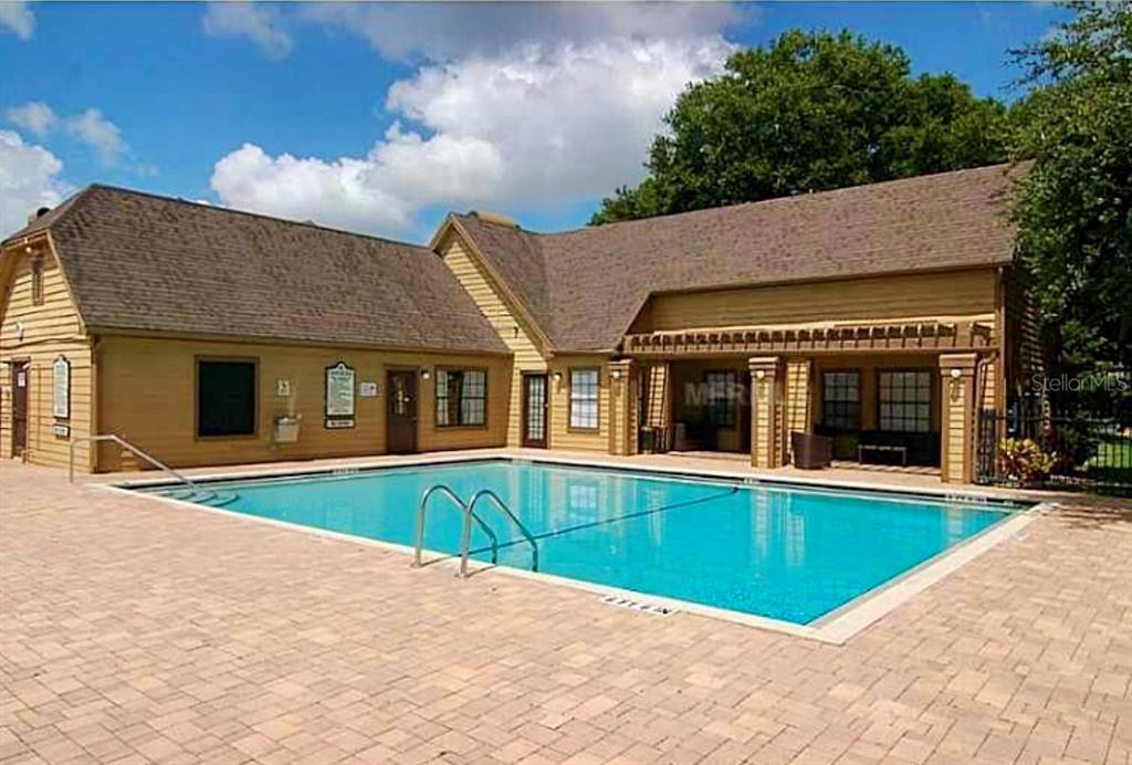 390 Woodside Drive, Unit 202 Altamonte Springs, FL 32701 - Photo 3 of 10 a view of an house with swimming pool and porch