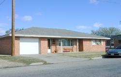 506-38 Southwest 38th Avenue Amarillo, TX 79110 - Photo 1 of 1 a front view of a house with a yard and garage