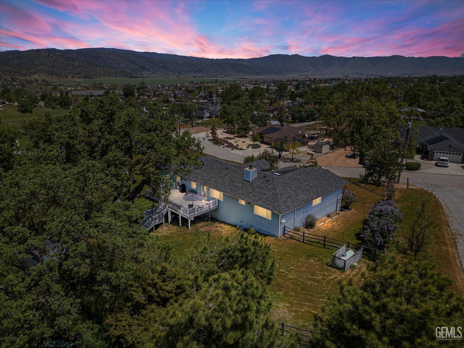 Undisclosed Address Tehachapi, CA 93561 - Photo 2 of 47 a view of a lush green hillside and houses