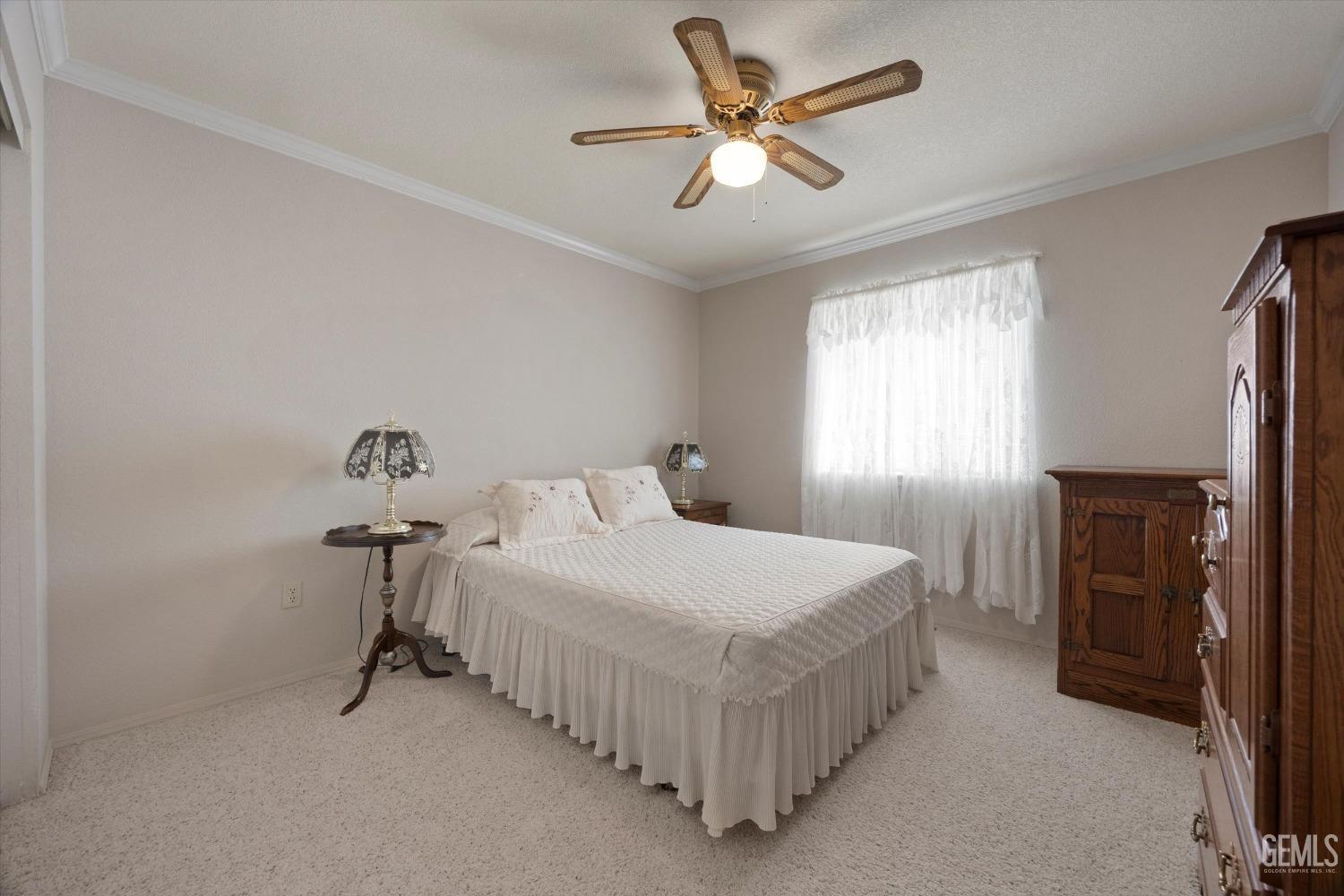 Undisclosed Address Tehachapi, CA 93561 - Photo 27 of 47 a bedroom with a bed and a chandelier