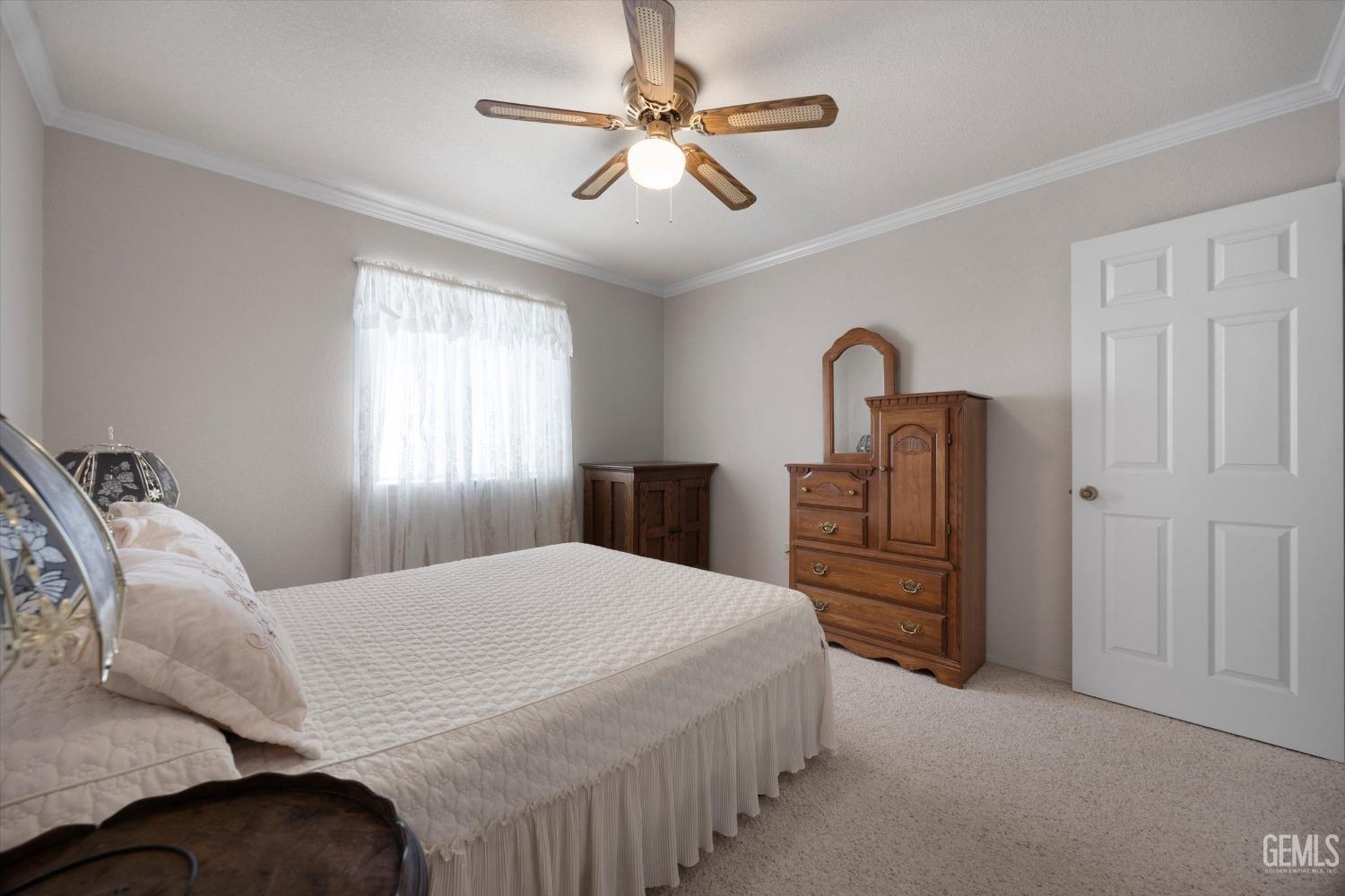 Undisclosed Address Tehachapi, CA 93561 - Photo 28 of 47 a bedroom with a bed and a chandelier