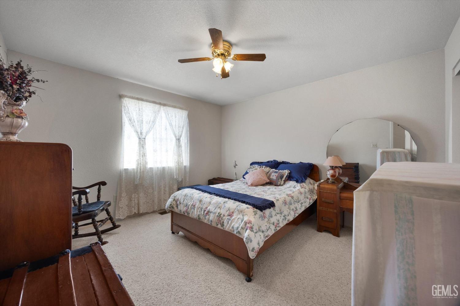 Undisclosed Address Tehachapi, CA 93561 - Photo 30 of 47 a bedroom with a bed and window