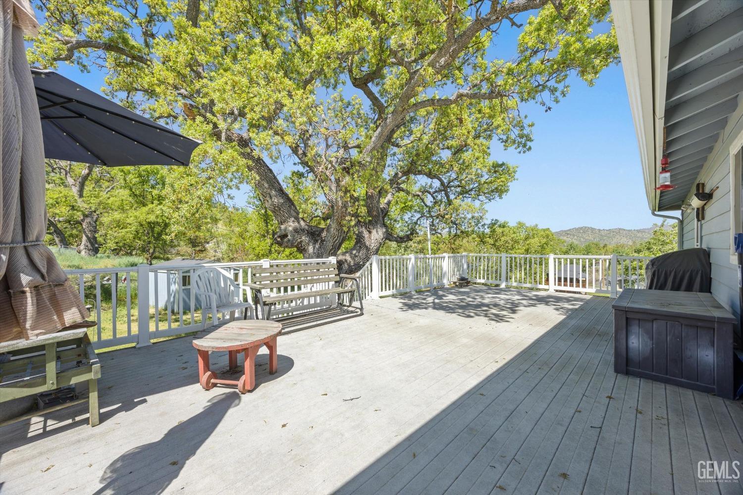 Undisclosed Address Tehachapi, CA 93561 - Photo 39 of 47 a view of roof deck with chairs and wooden floor