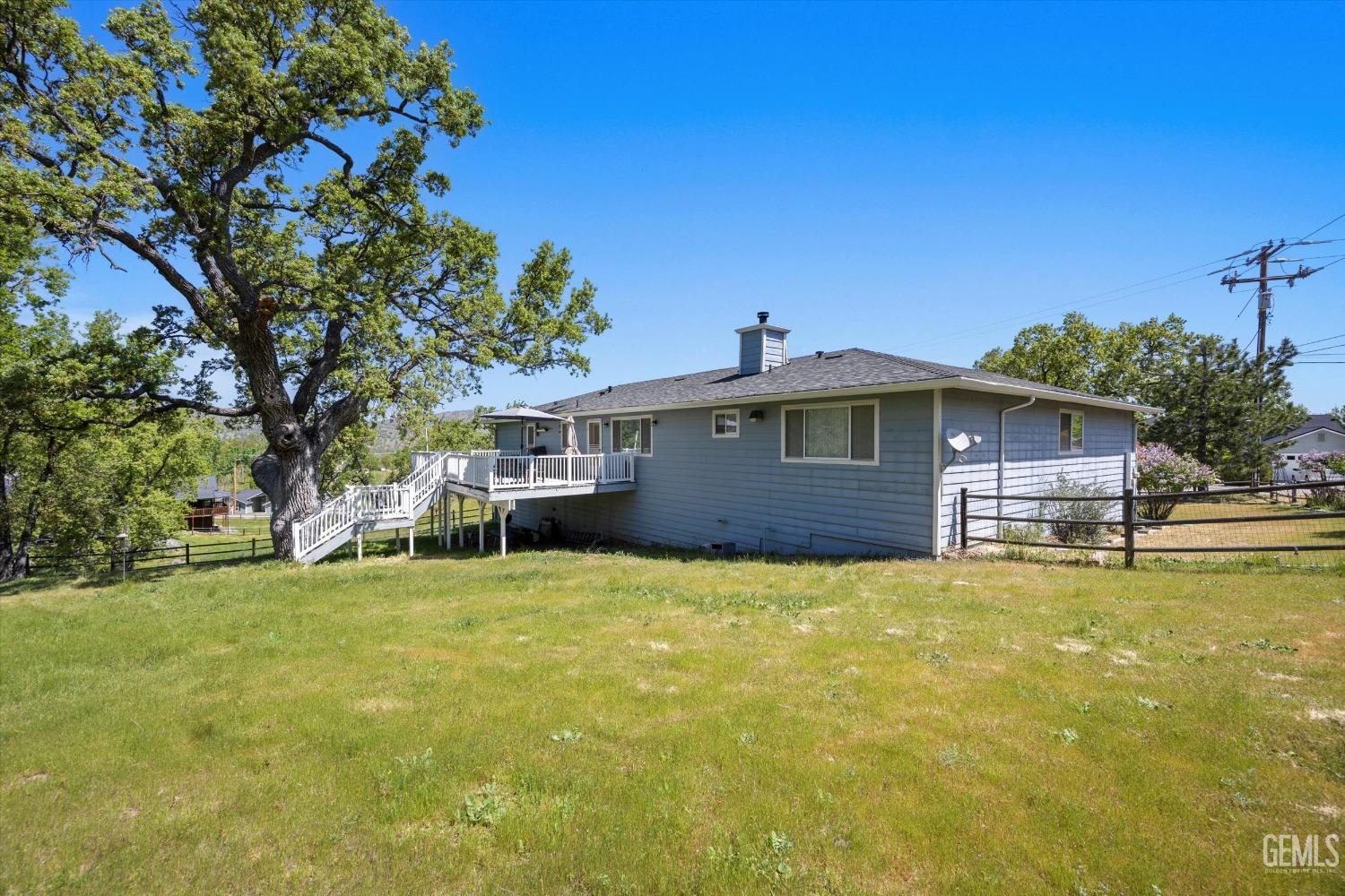 Undisclosed Address Tehachapi, CA 93561 - Photo 44 of 47 a front view of a house with a garden