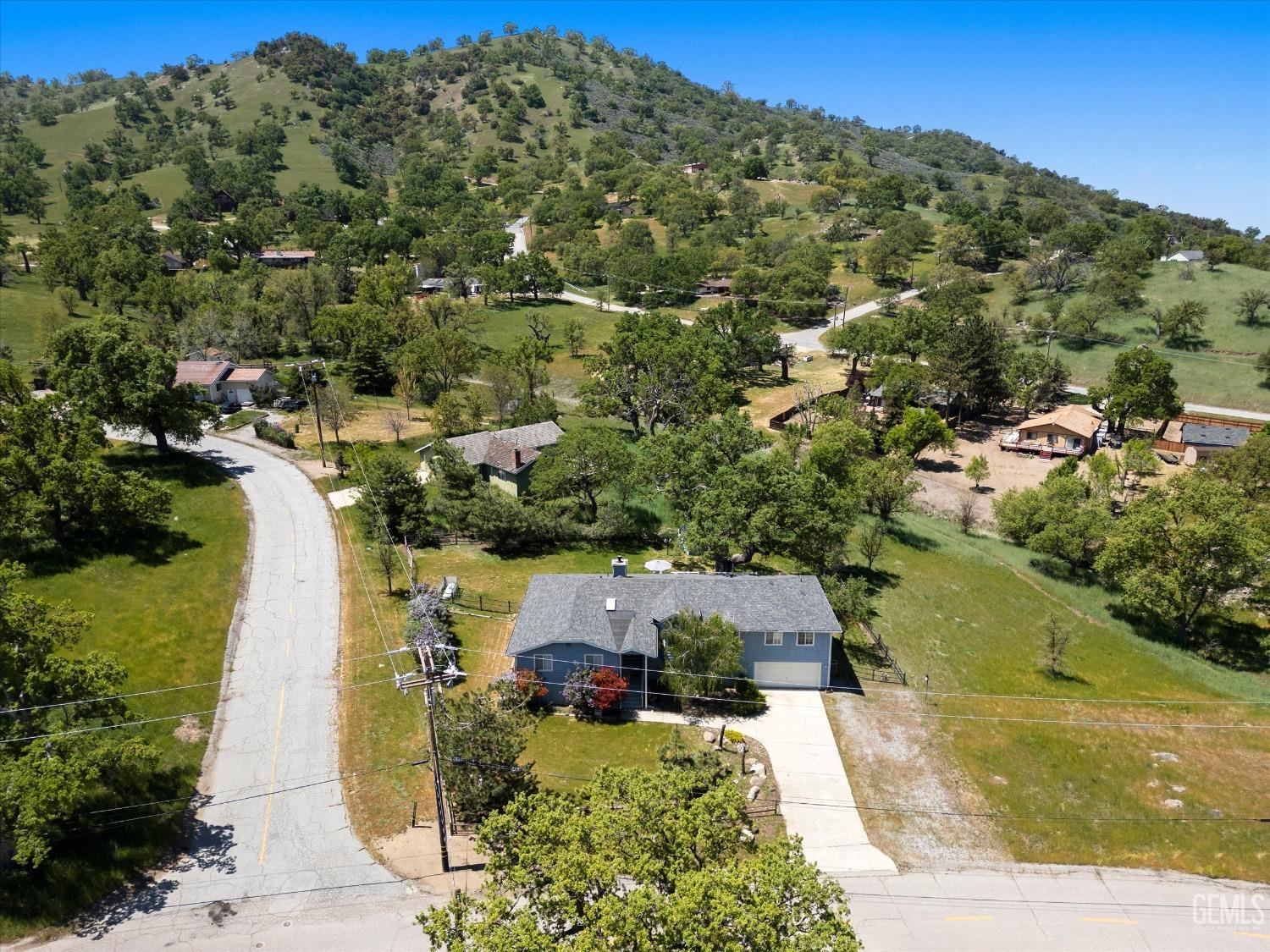Undisclosed Address Tehachapi, CA 93561 - Photo 5 of 47 an aerial view of a house with a yard