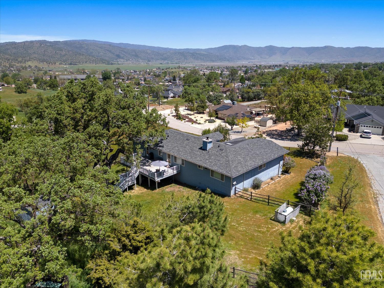 Undisclosed Address Tehachapi, CA 93561 - Photo 7 of 47 an aerial view of a house with a mountain