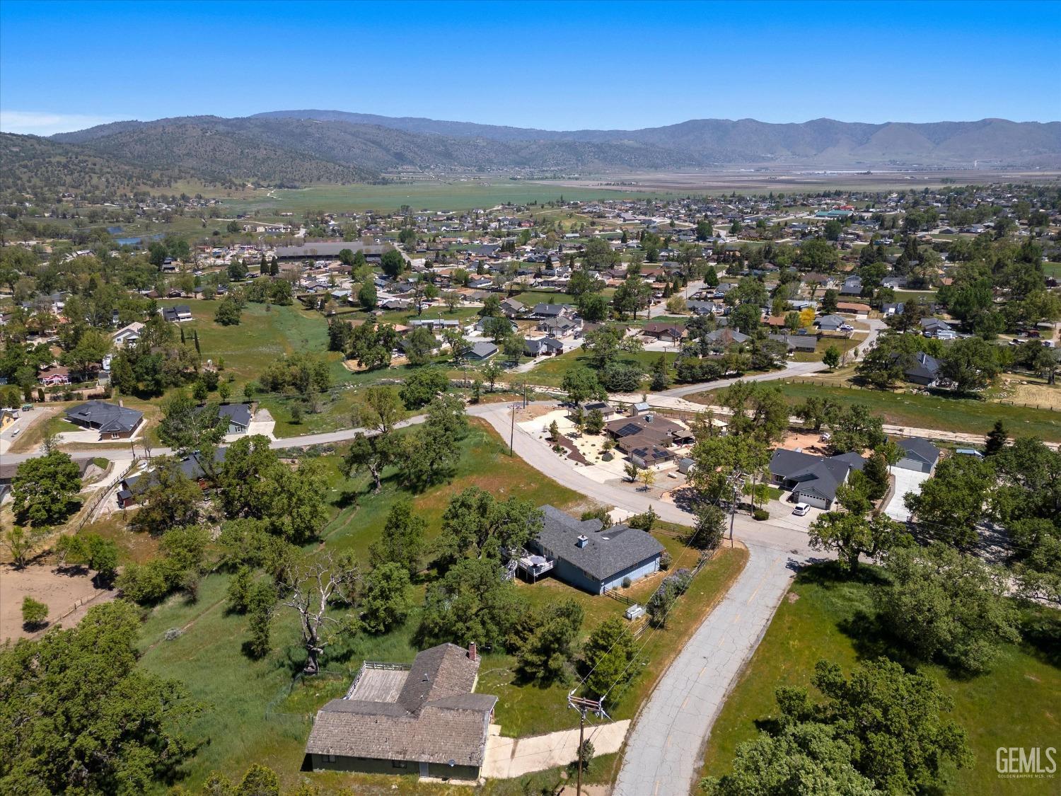 Undisclosed Address Tehachapi, CA 93561 - Photo 9 of 47 an aerial view of residential house with yard and mountain view in back