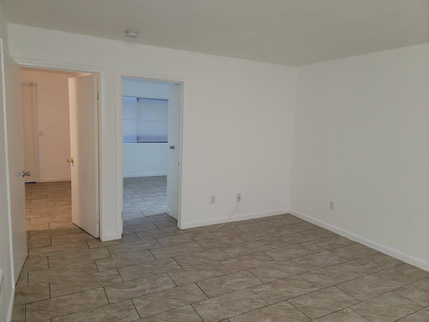 43965 Towne Street Indio, CA 92201 - Photo 11 of 31 wooden floor in an empty room