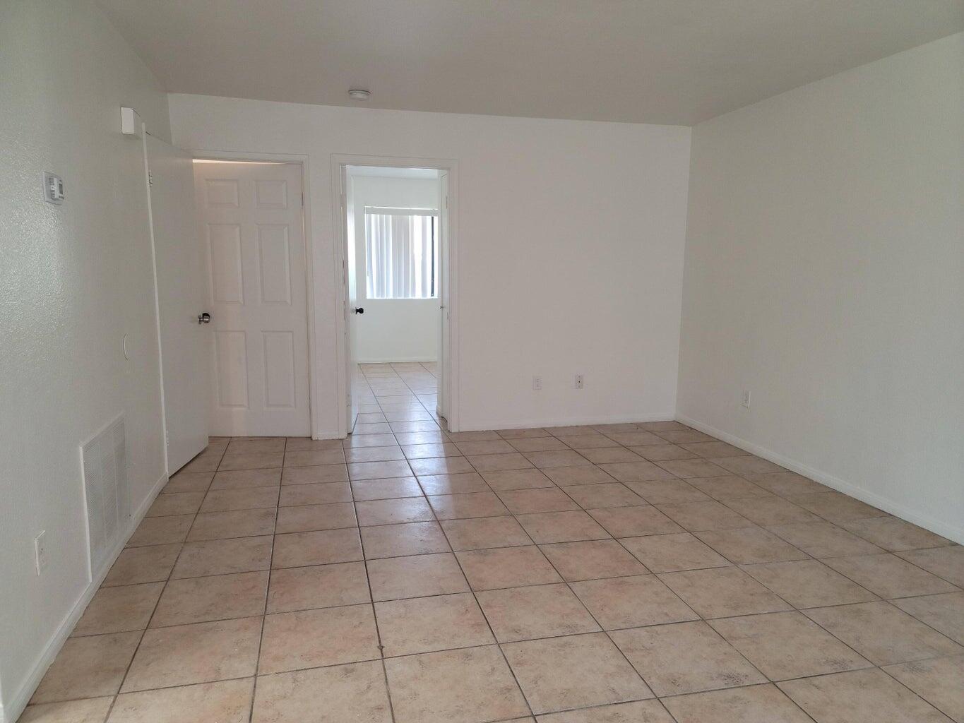 43965 Towne Street Indio, CA 92201 - Photo 18 of 31 a view of a livingroom with an empty space and a window