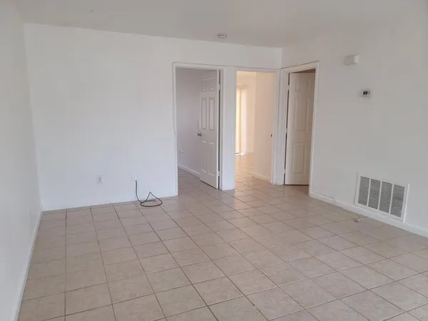 a view of an empty room and window