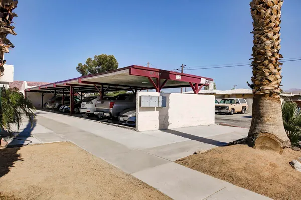 a view of a car park in front of retail shop