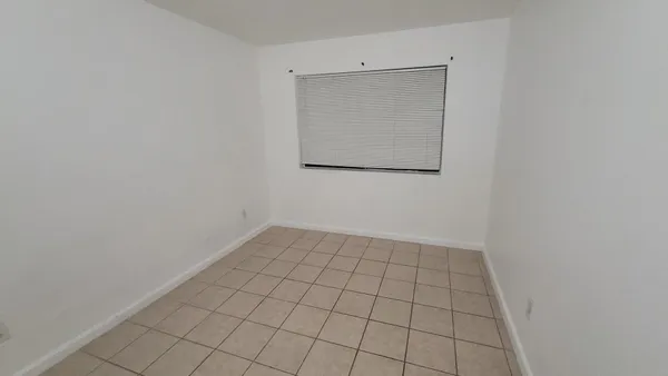 an empty room with white door
