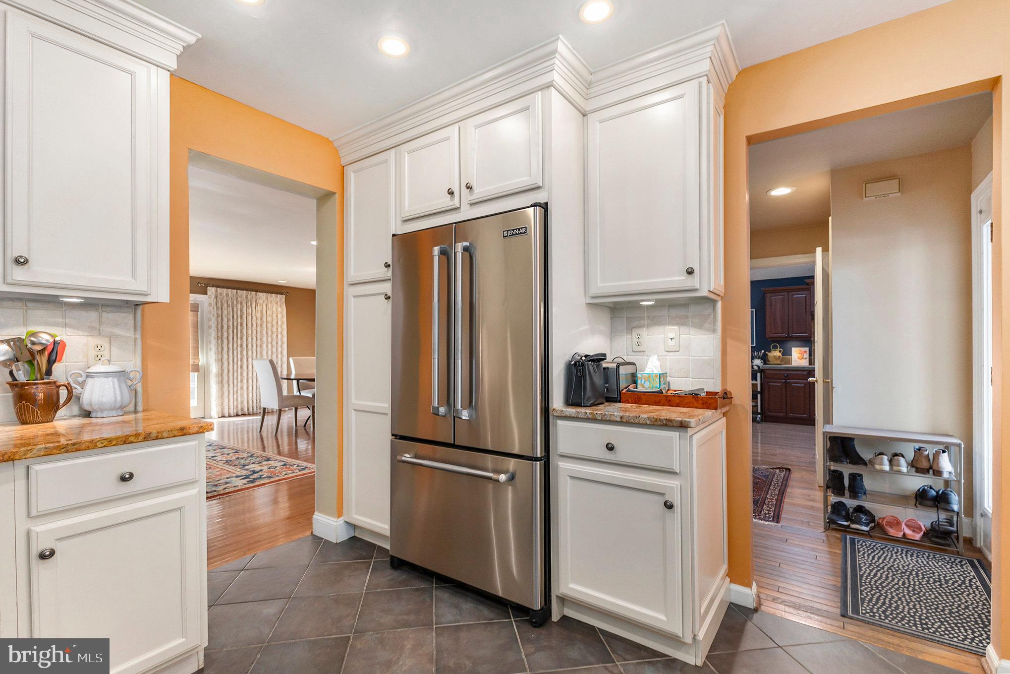 6 Lantern Lane Chesterbrook, PA 19087 - Photo 17 of 37 a kitchen with white cabinets and stainless steel appliances