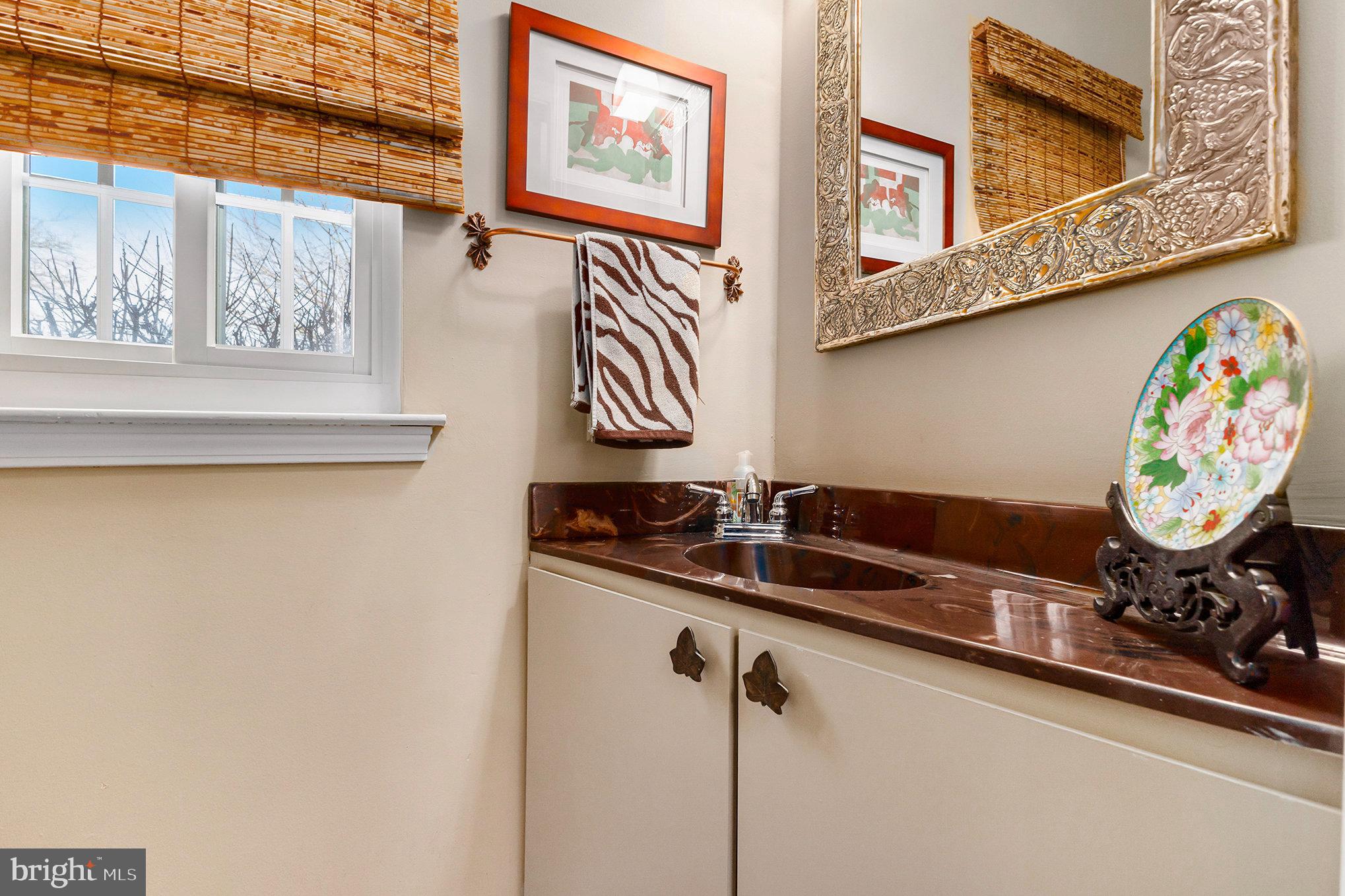 6 Lantern Lane Chesterbrook, PA 19087 - Photo 18 of 37 a bathroom with a sink and a mirror