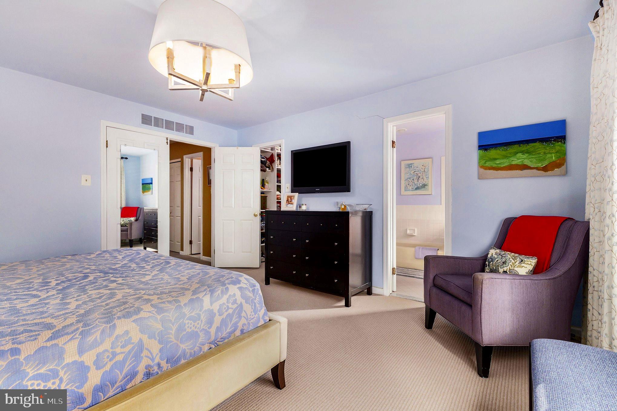 6 Lantern Lane Chesterbrook, PA 19087 - Photo 20 of 37 a spacious bedroom with a bed and a flat screen tv