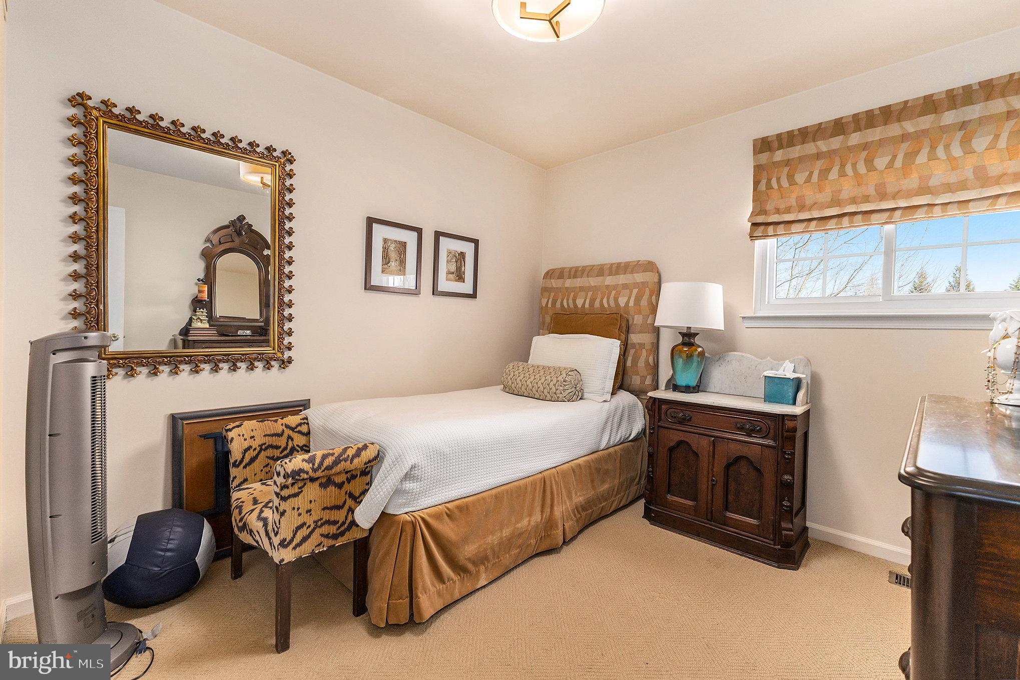 6 Lantern Lane Chesterbrook, PA 19087 - Photo 25 of 37 a bedroom with a bed and a fireplace